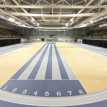 Indoor track hall in Glasgow International Arena, large beams visible