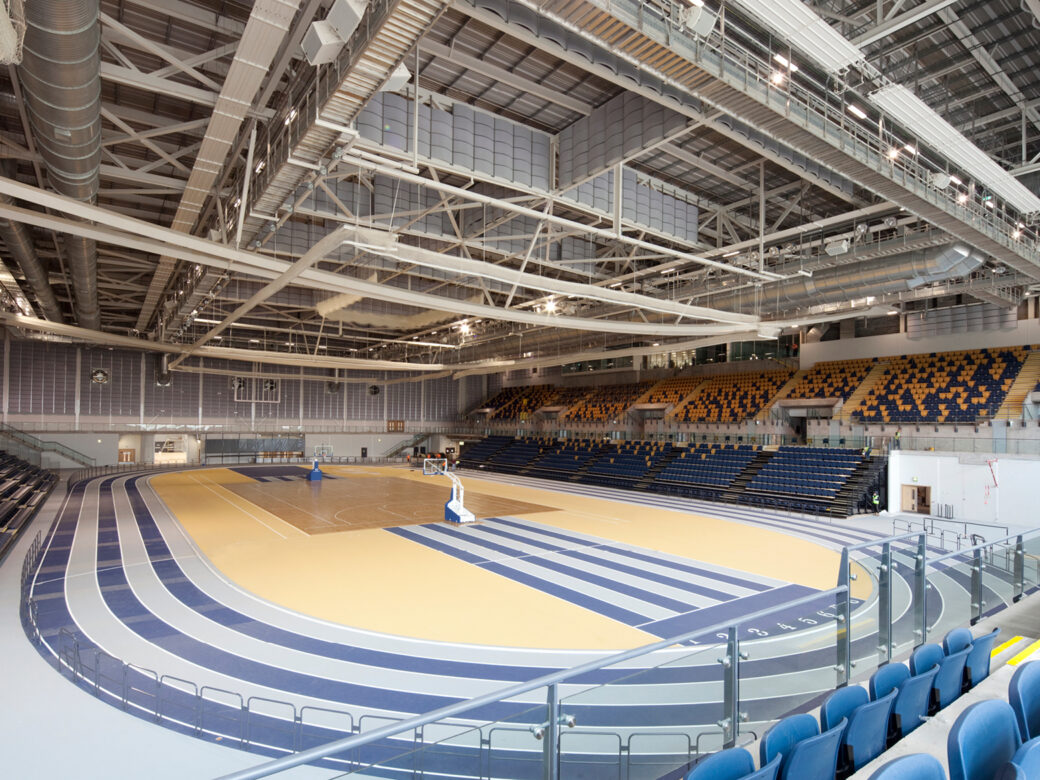 Indoor track hall in Glasgow International Arena, large beams visible